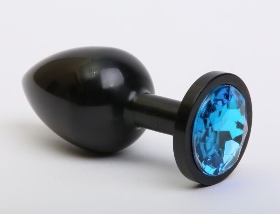 Чёрная анальная пробка с голубым стразом - 7,6 см. Чёрная анальная пробка с голубым стразом - 7,6 см.